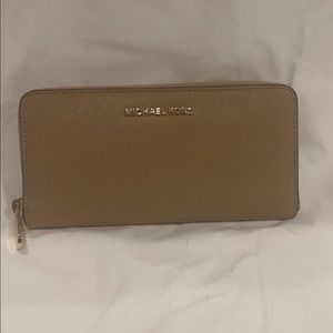 Tan Michael Kors wallet in great condition and new!